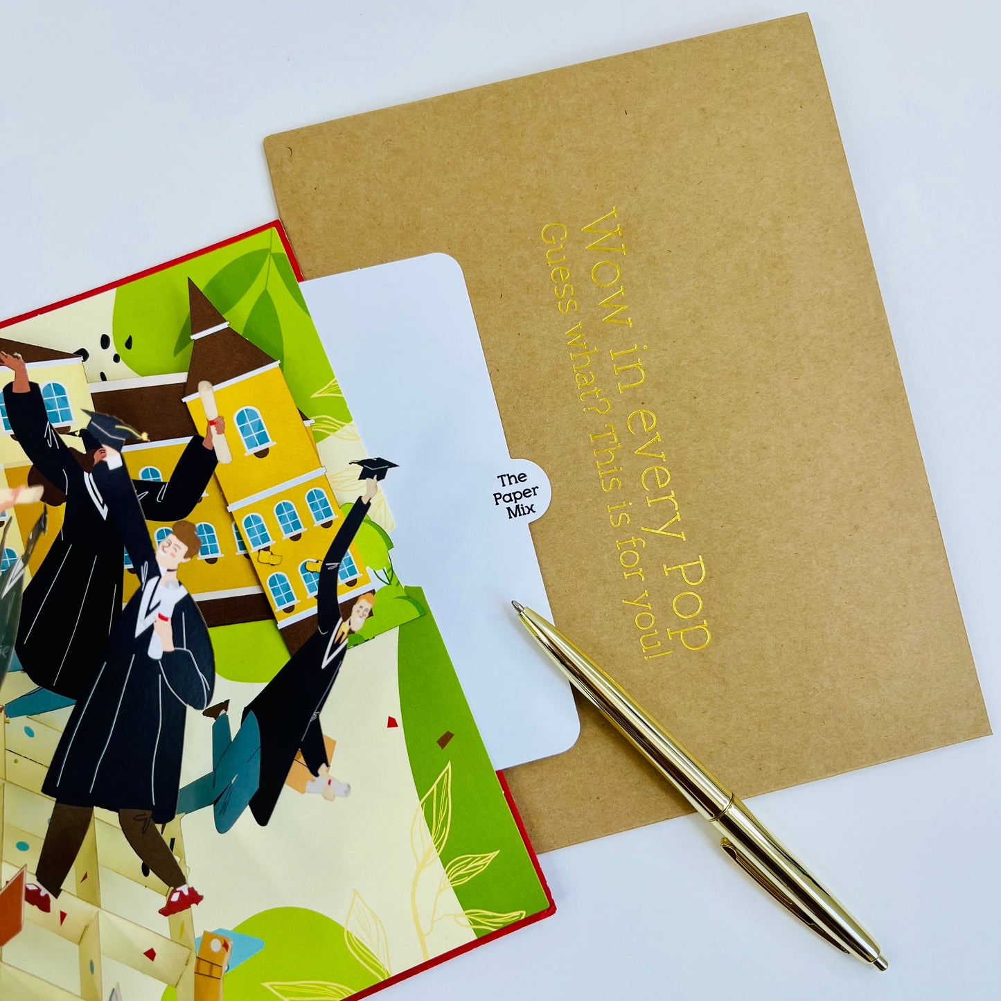 3d pop up card with a colorful illustration of people and a pen on a white background.