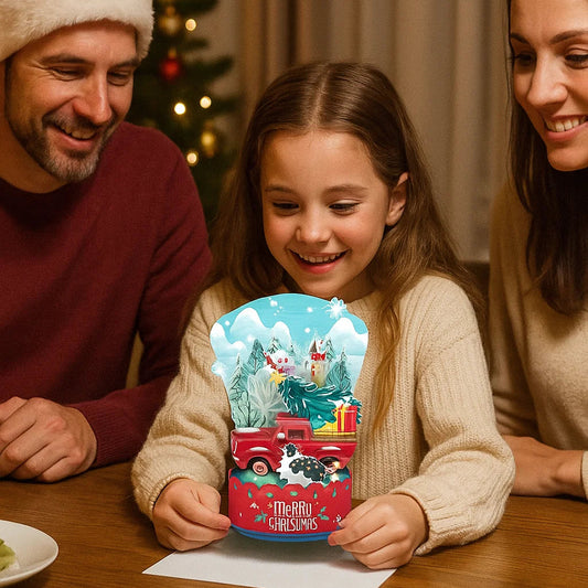 Family gathered around a table with a child holding a Christmas-themed gift box.