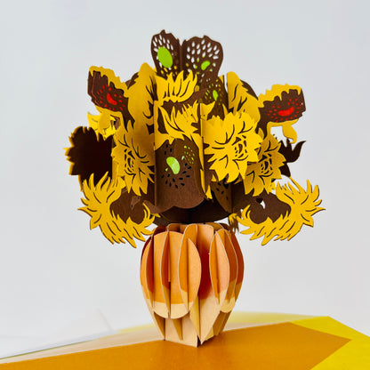 3D paper craft of a vase with sunflowers on a white background