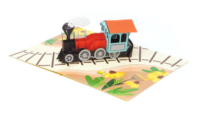3D pop-up train card with a steam locomotive on a white background