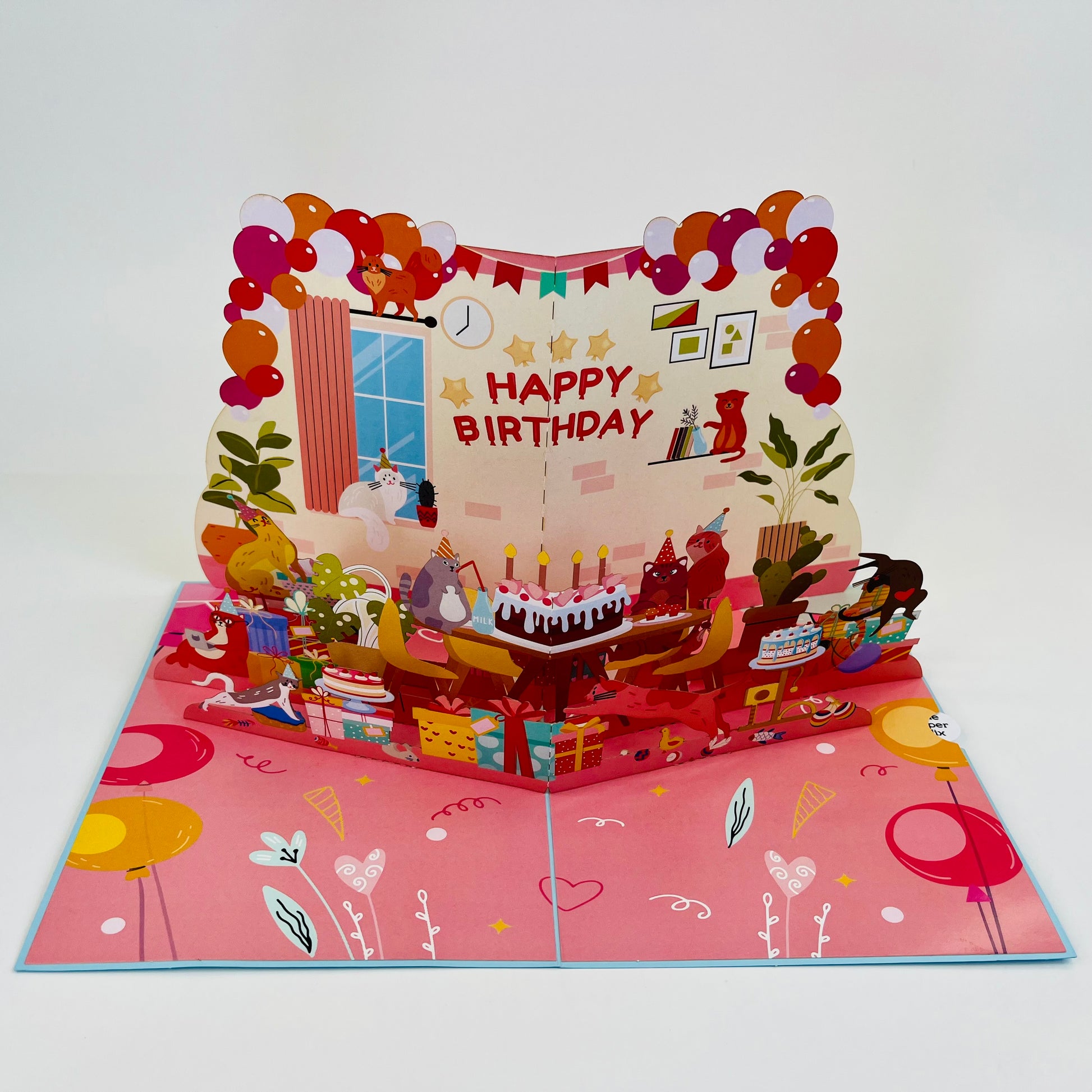 Pop-up birthday card with birthday cake and balloons